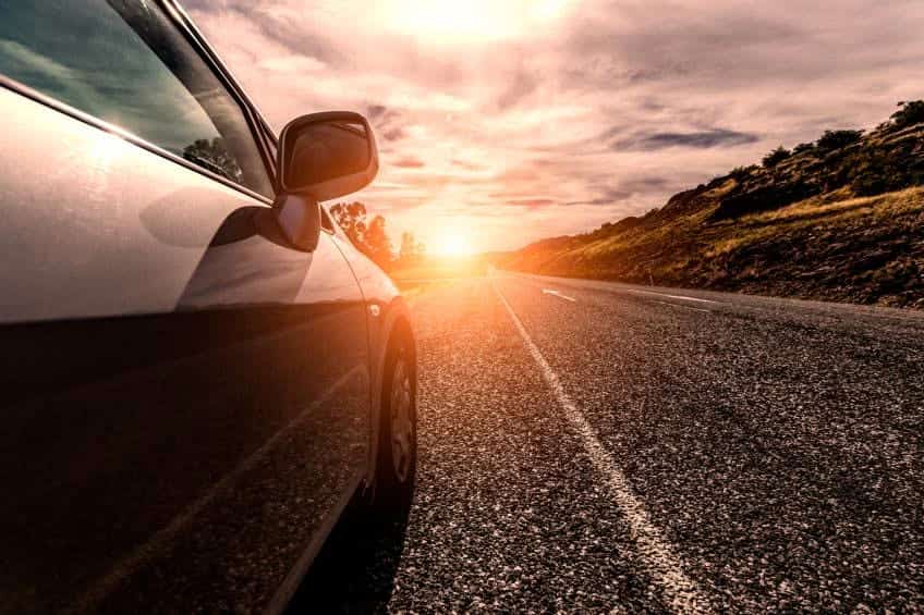 car driving on sunny road