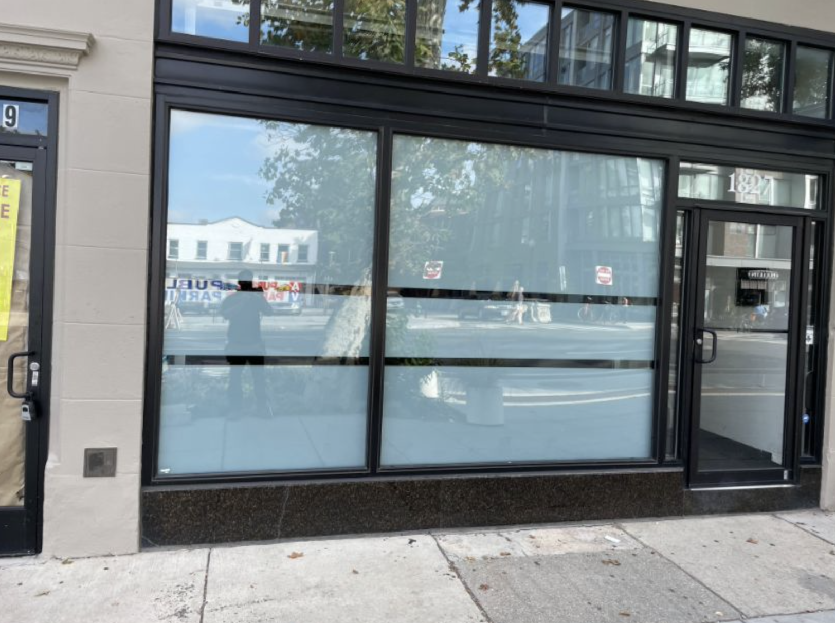 Decorative window film from Professional Window Tint in Delaware adds privacy and security to a business storefront window.