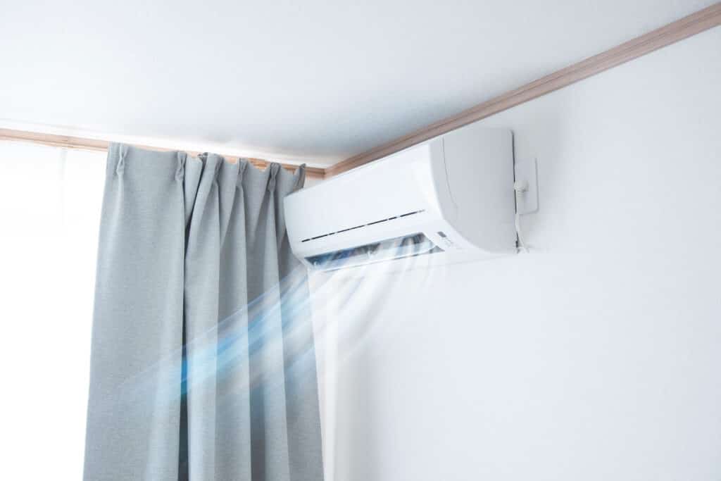 An air conditioning unit, blowing cool air into a room.