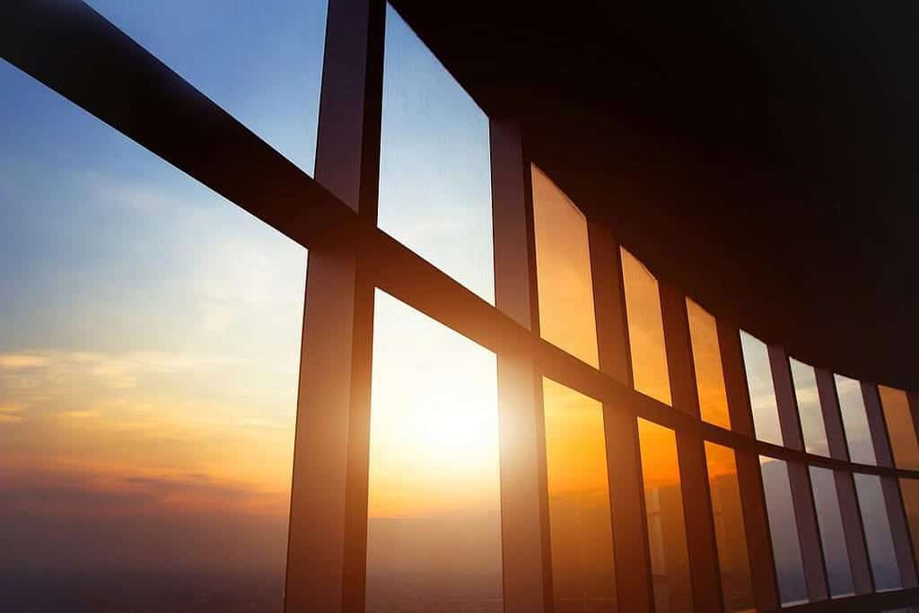 Solar rays emanating though a set of glass windows.
