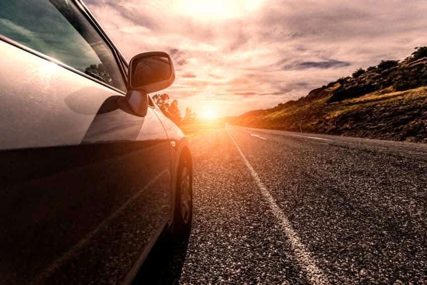 car driving on sunny road